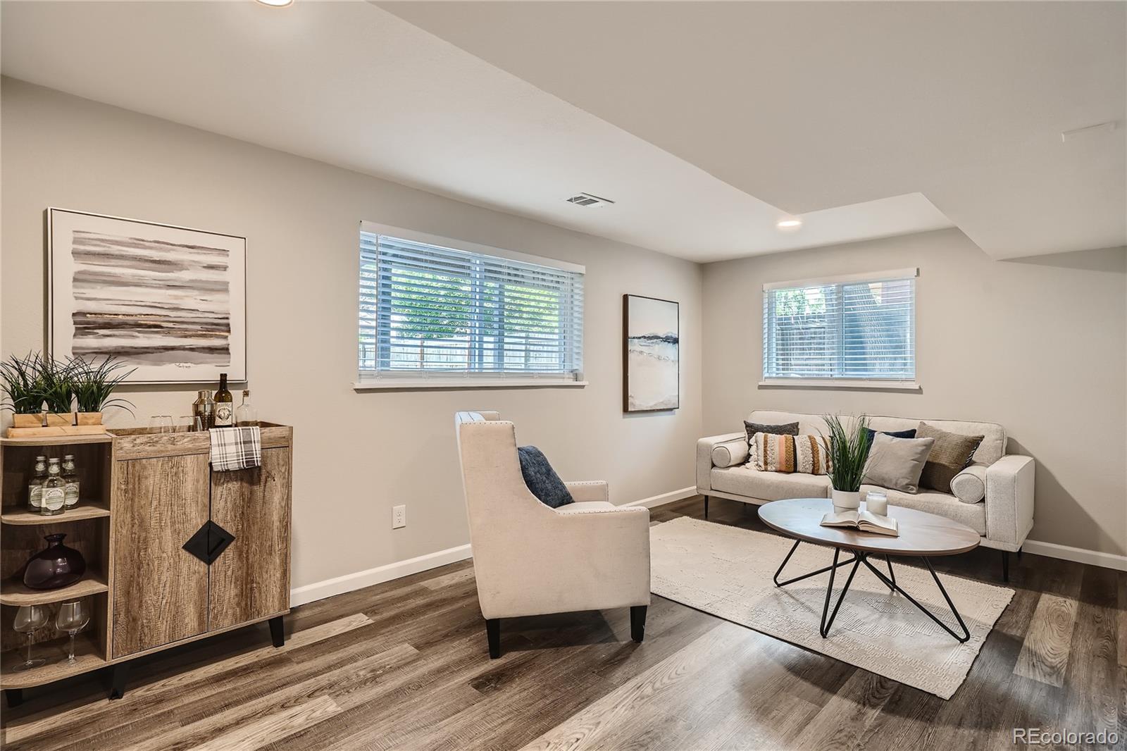 8506 Eaton Street Arvada, CO 80003 - Photo 22 of 28 a living room with furniture and a window