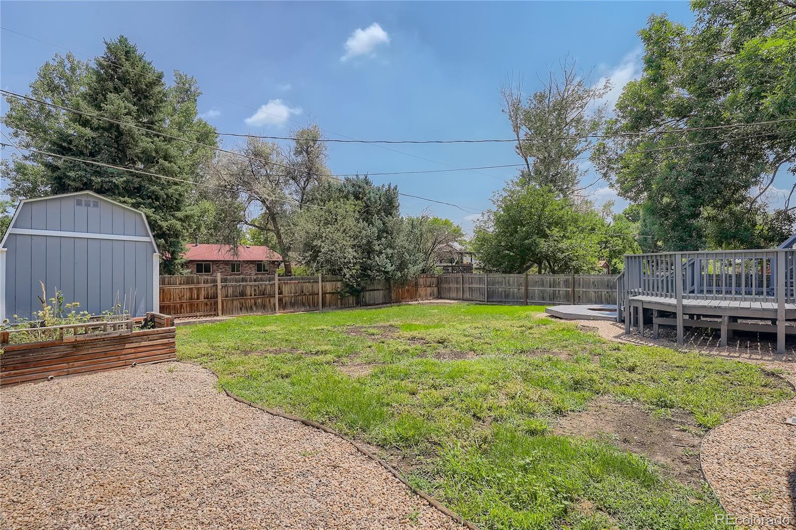 8506 Eaton Street Arvada, CO 80003 - Photo 26 of 28 a view of a chair and table in the garden