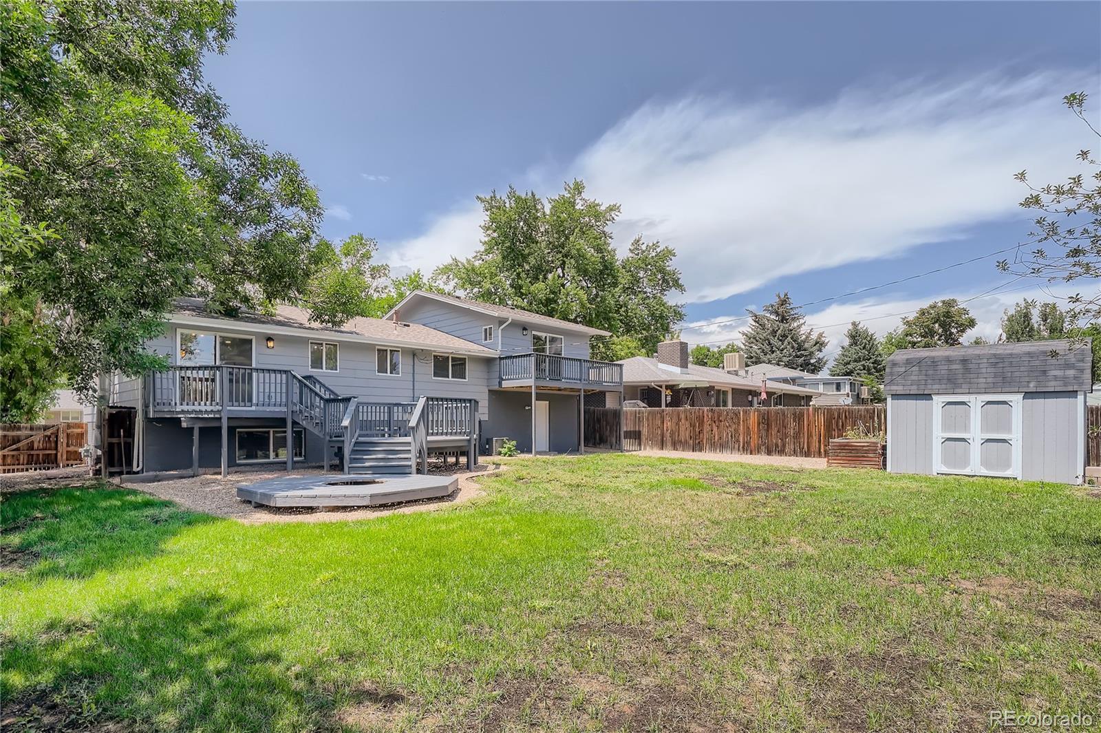 8506 Eaton Street Arvada, CO 80003 - Photo 27 of 28 a house view with a sitting space and garden