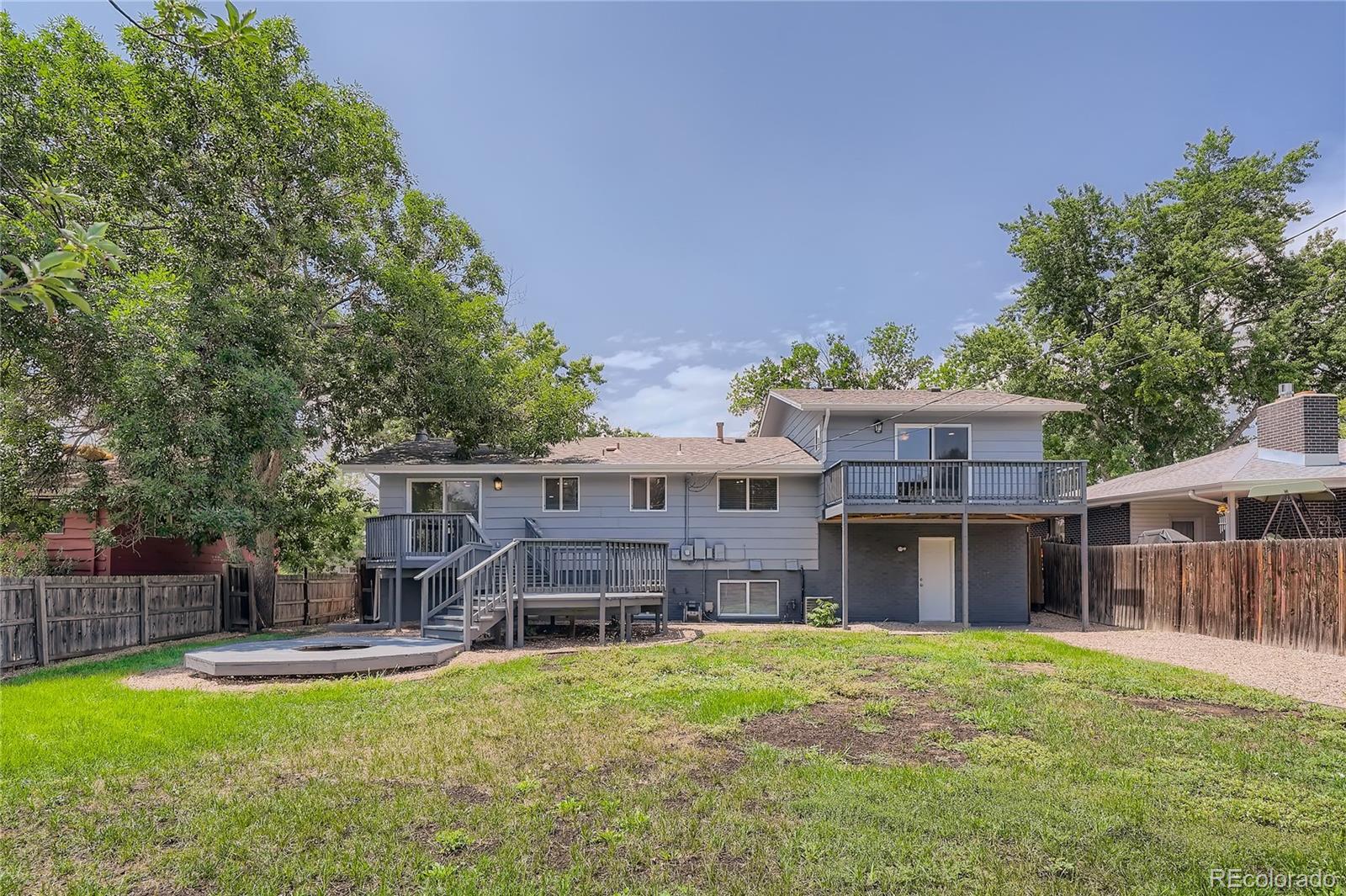 8506 Eaton Street Arvada, CO 80003 - Photo 28 of 28 a view of a house with furniture and a yard