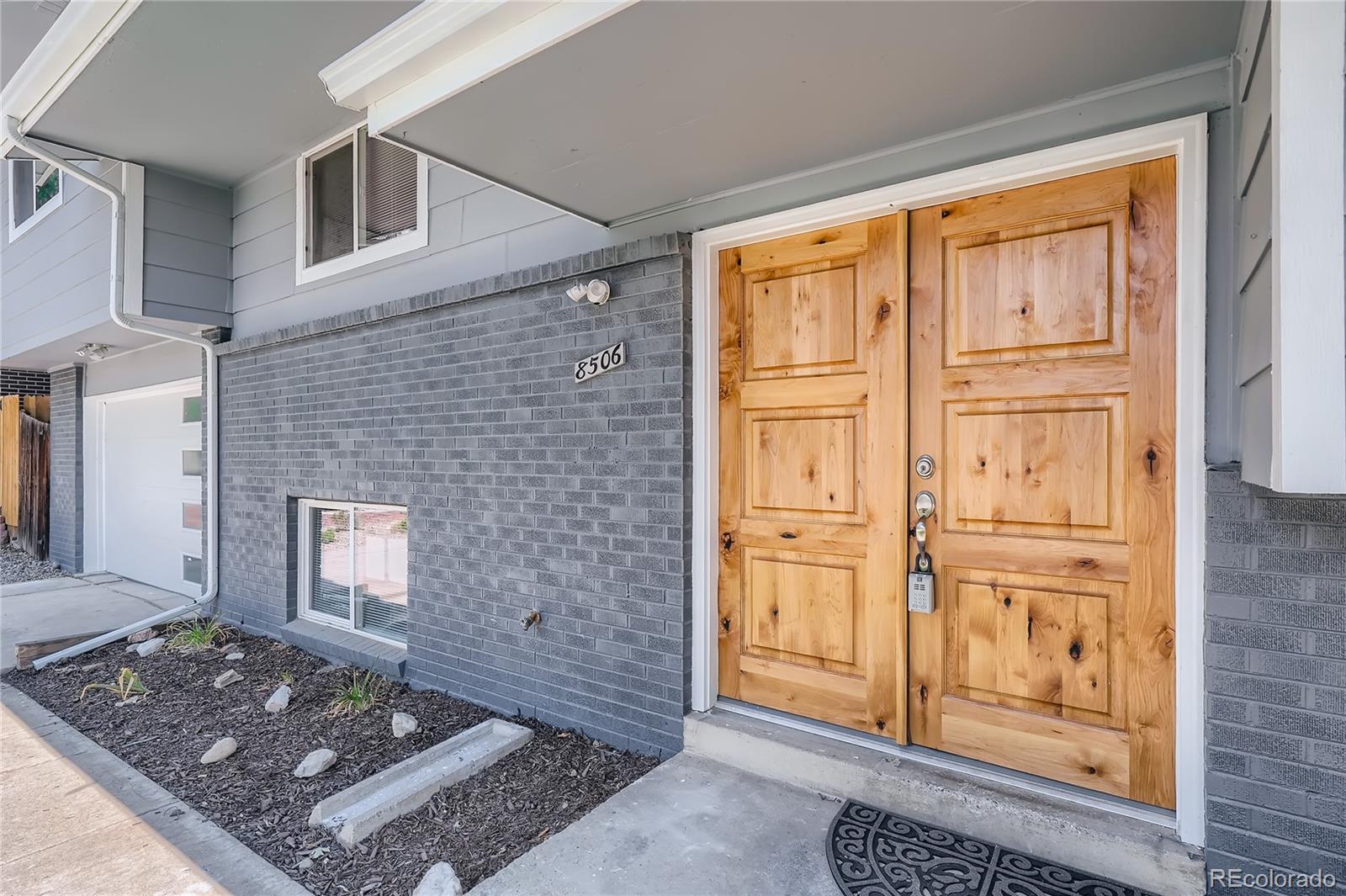 8506 Eaton Street Arvada, CO 80003 - Photo 3 of 28 a view of an entryway door