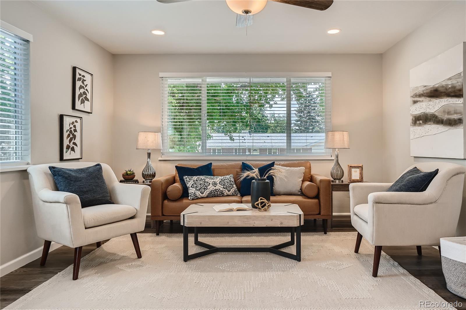 8506 Eaton Street Arvada, CO 80003 - Photo 6 of 28 a living room with furniture and a large window