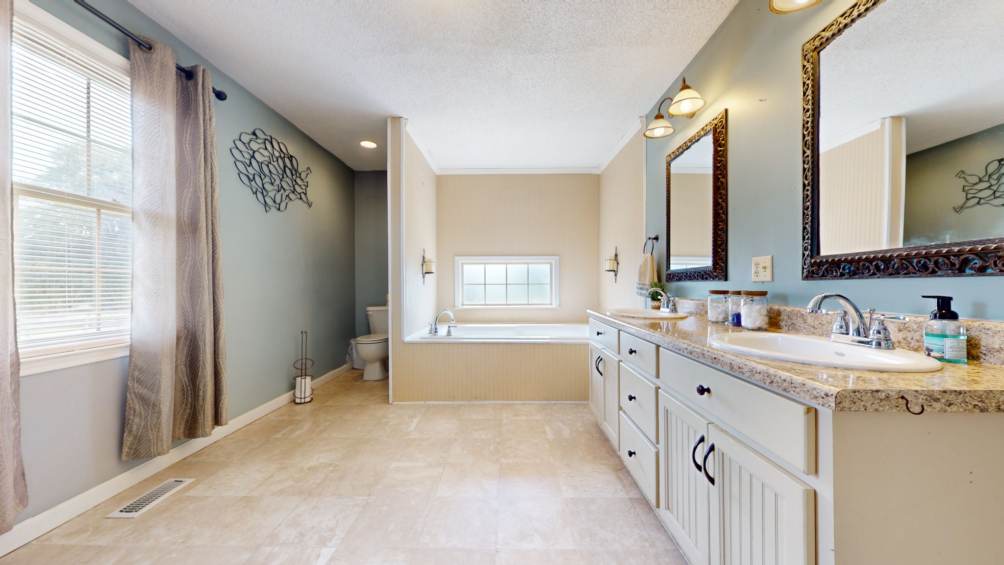 511 Limestone Road Elora, TN 37328 - Photo 27 of 55 a bathroom with double vanity and a bathtub