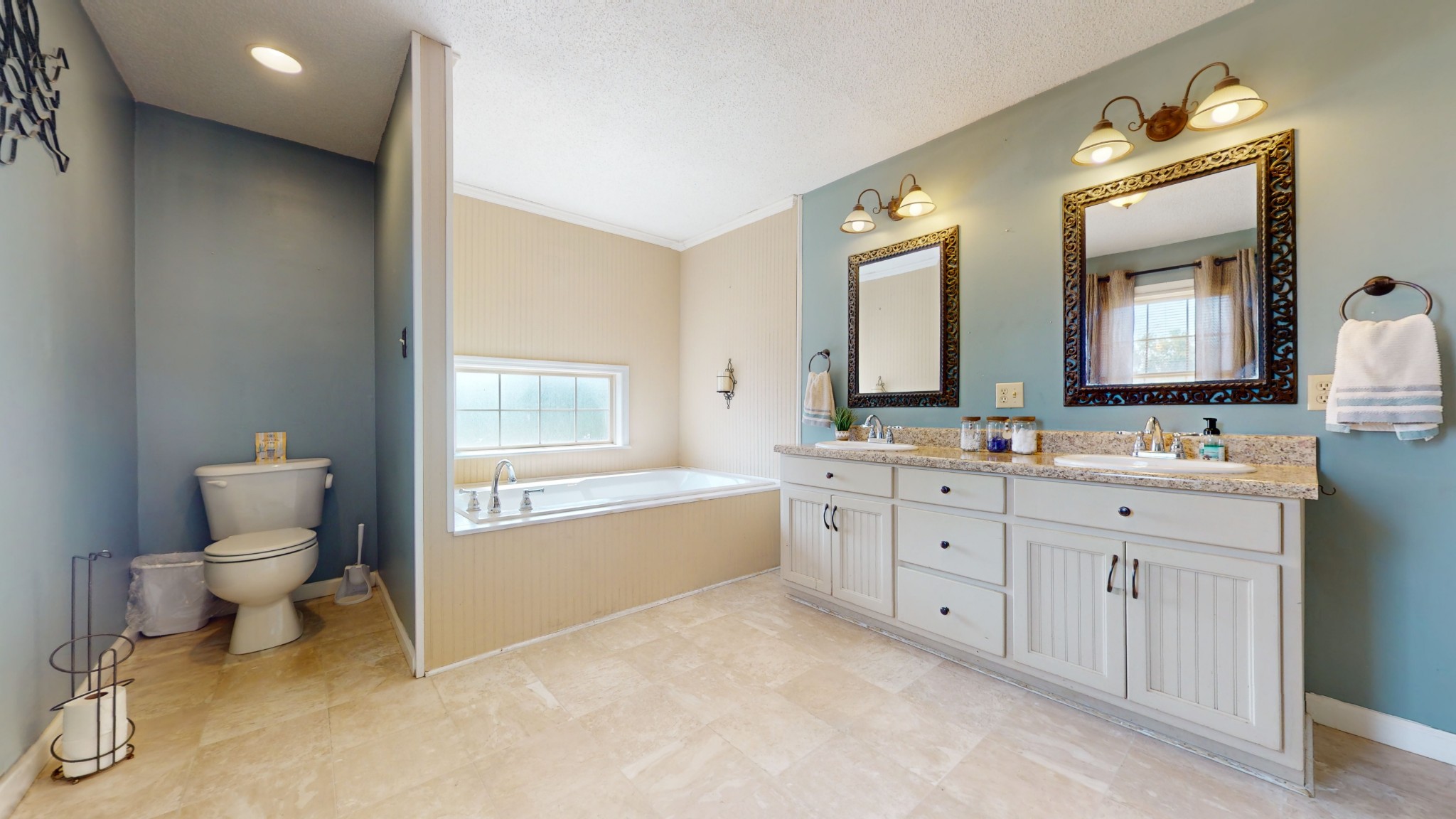 511 Limestone Road Elora, TN 37328 - Photo 28 of 55 a bathroom with a granite countertop toilet sink and a mirror