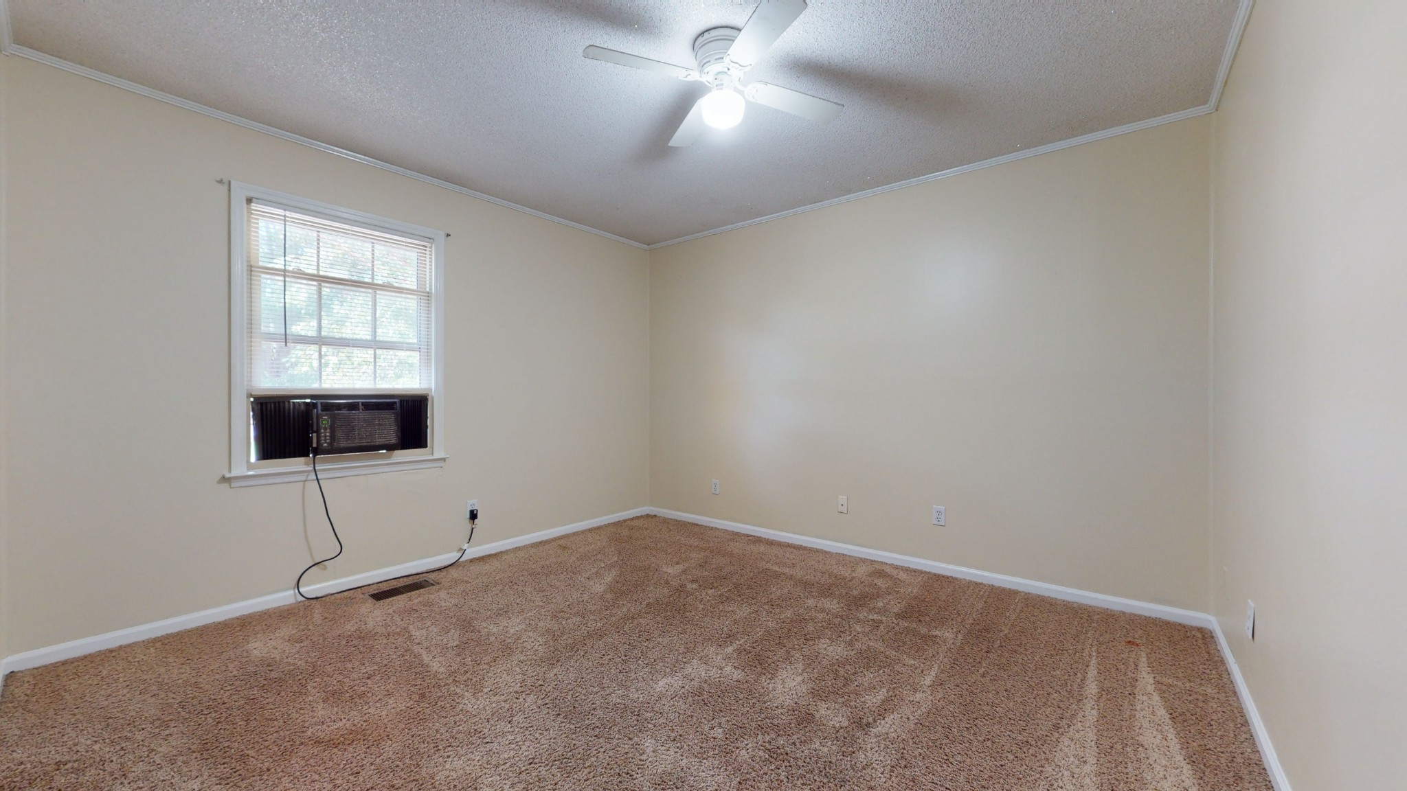 511 Limestone Road Elora, TN 37328 - Photo 35 of 55 an empty room with a ceiling fan and a window