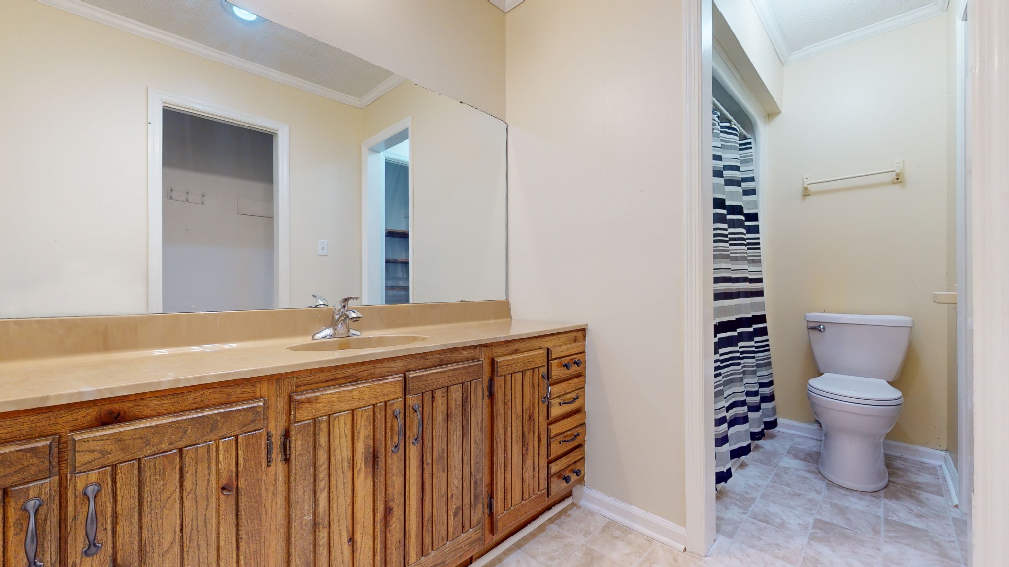 511 Limestone Road Elora, TN 37328 - Photo 37 of 55 a bathroom with a granite countertop sink a toilet and a mirror
