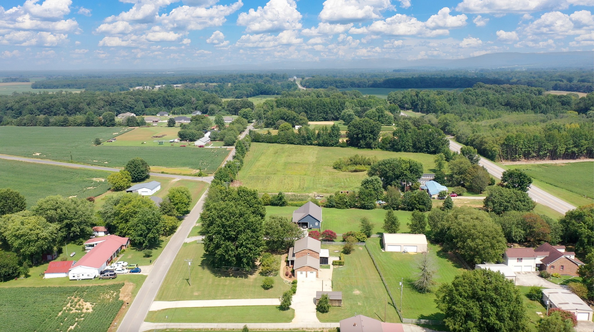 511 Limestone Road Elora, TN 37328 - Photo 42 of 55 an aerial view of residential houses with outdoor space and lake view