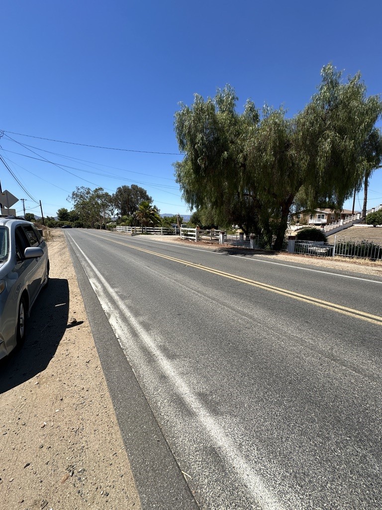 0 Goetz Road Menifee, CA 92587 - Photo 7 of 10 a view of city street with a car parked on the road