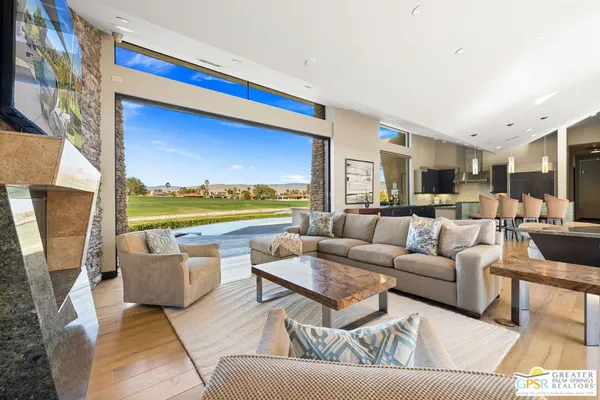 a kitchen with stainless steel appliances granite countertop a sink and a refrigerator