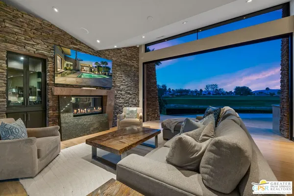 a view of a swimming pool with an outdoor seating