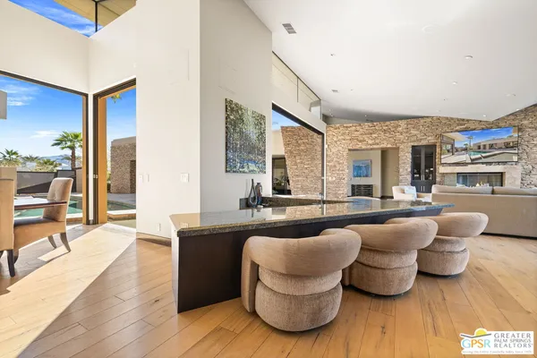 a spacious bathroom with a granite countertop sink a mirror and a shower