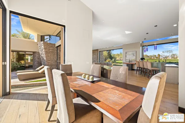 a bathroom with a granite countertop sink a toilet a mirror and shower
