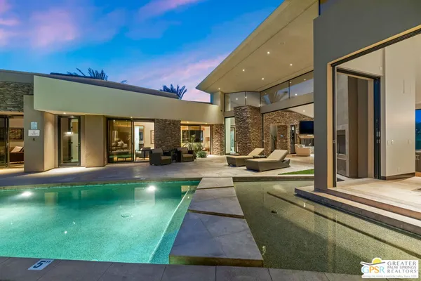 a bathroom with a granite countertop sink toilet a mirror and shower