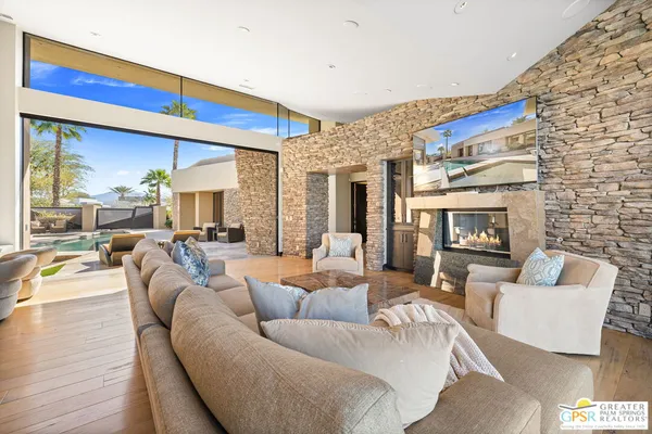 a bedroom with a large bed and a large window