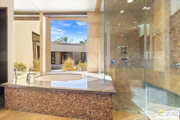 a bedroom with a bed and a lamp