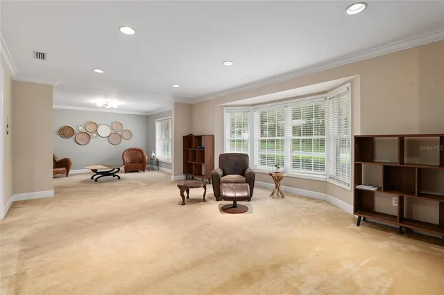 a kitchen with stainless steel appliances granite countertop wooden cabinets a stove a sink and a microwave