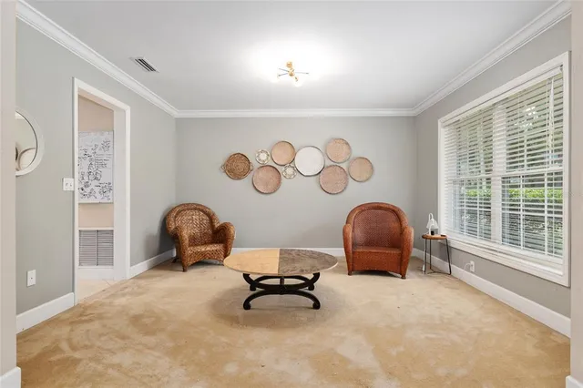 a spacious bedroom with a bed and a table