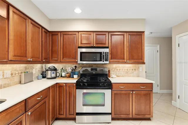 a bedroom with bed and a chandelier