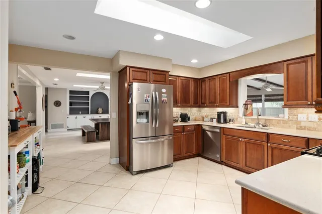 a bathroom with a granite countertop sink mirror and toilet