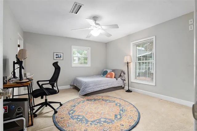 swimming pool with outdoor seating and garden