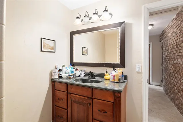 an aerial view of a house with a yard basket ball court and outdoor seating