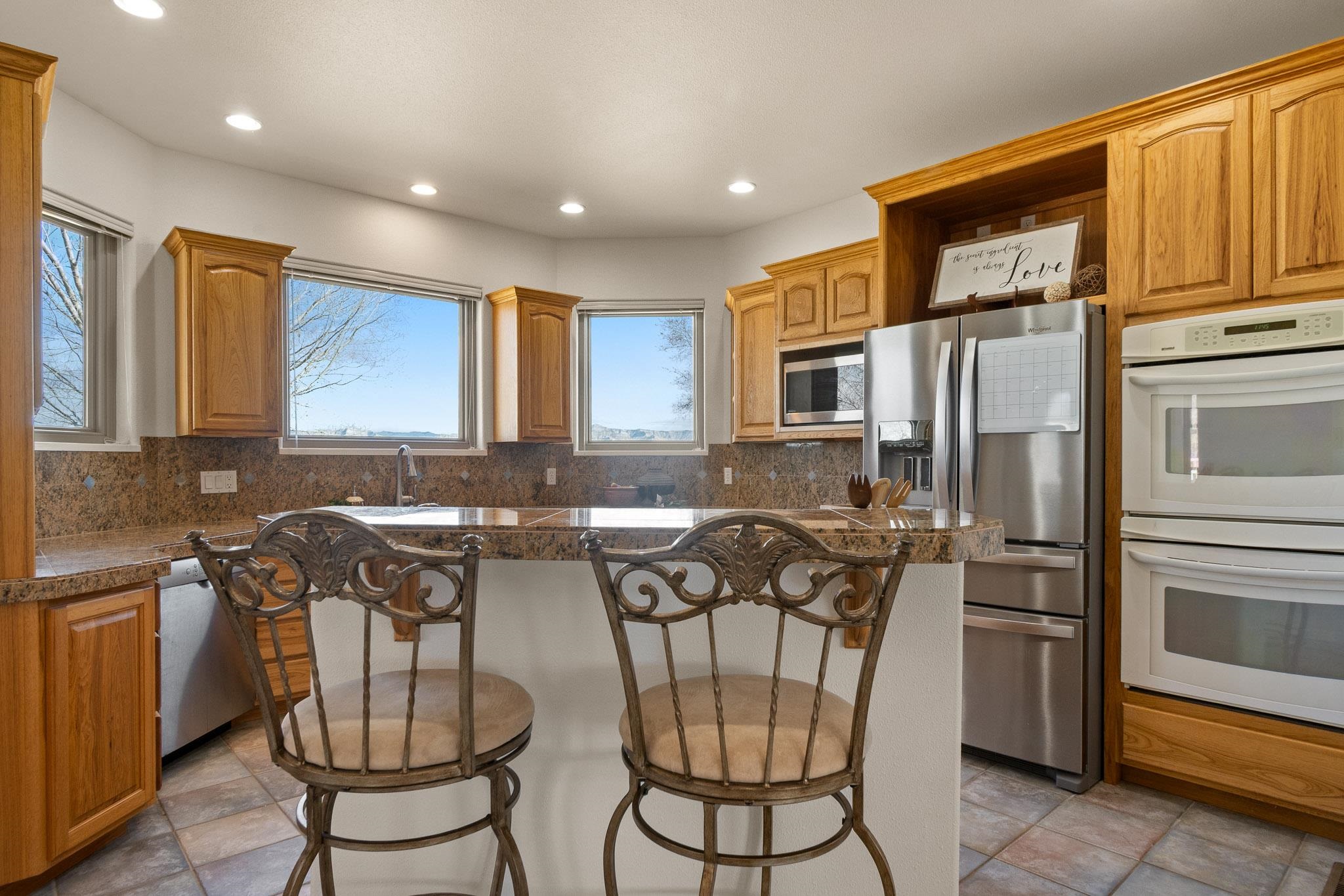 2107 I I- 1/2 Road Grand Junction, CO 81505 - Photo 9 of 42 a kitchen with a refrigerator and a sink