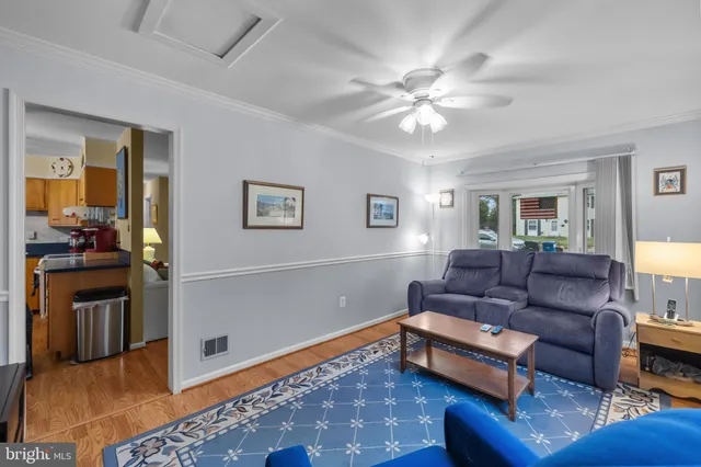 a living room with furniture and a rug