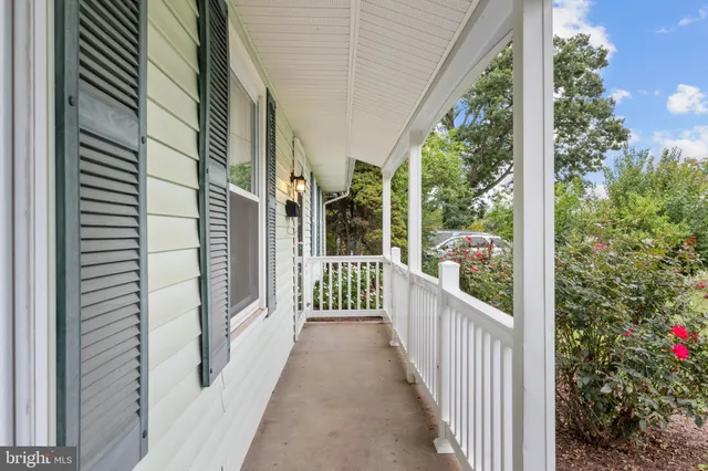 a view of a balcony with wooden floor