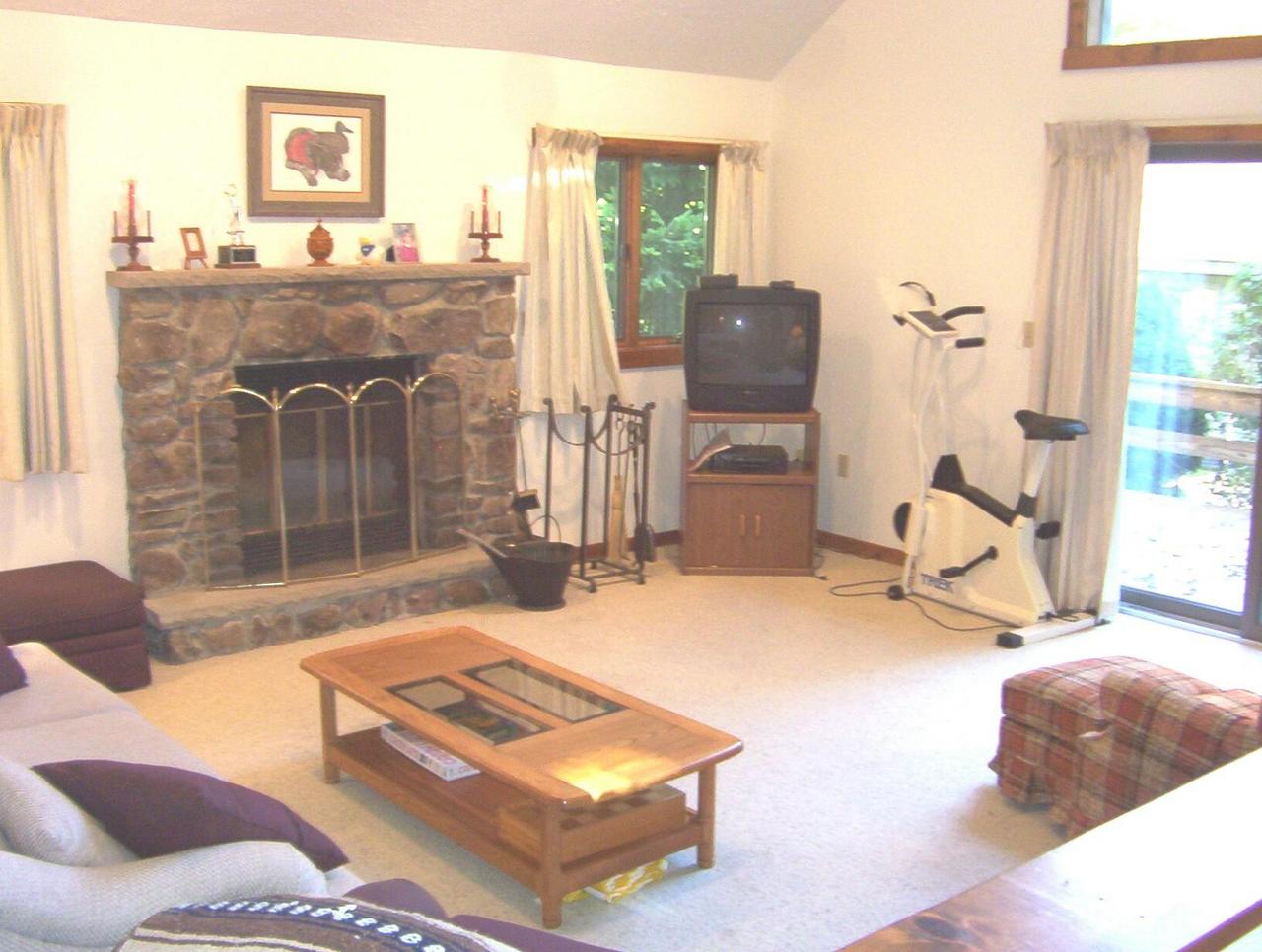 Living room w/stone fireplace