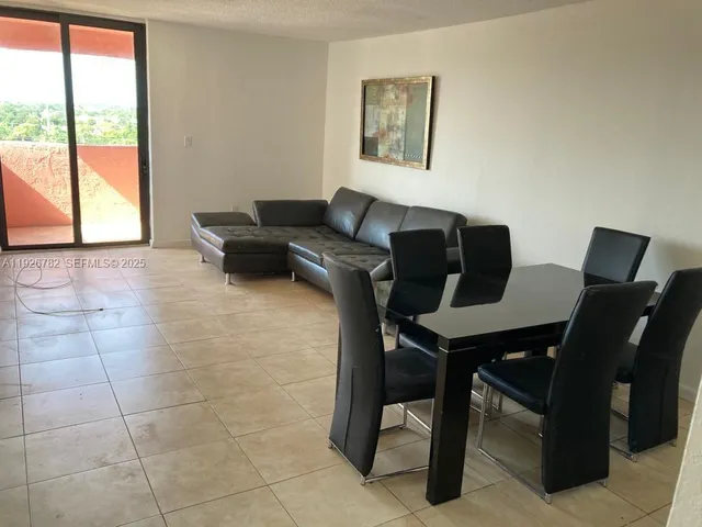 a work room with furniture and a window