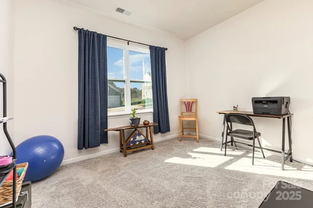 a bathroom with a sink a toilet and a shower curtain