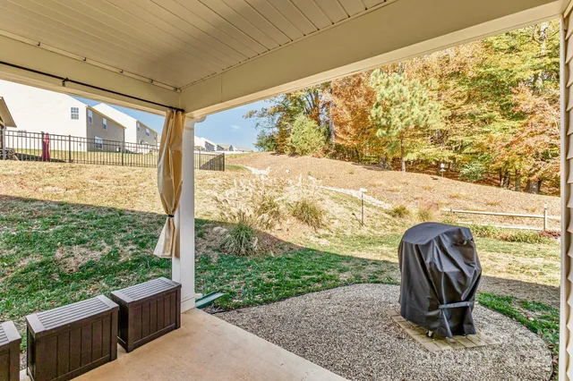 a view of a house with a door and wooden floor
