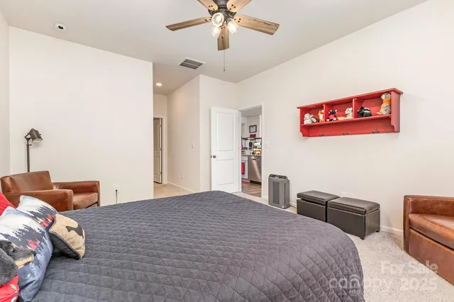 a bathroom with a shower and mirror