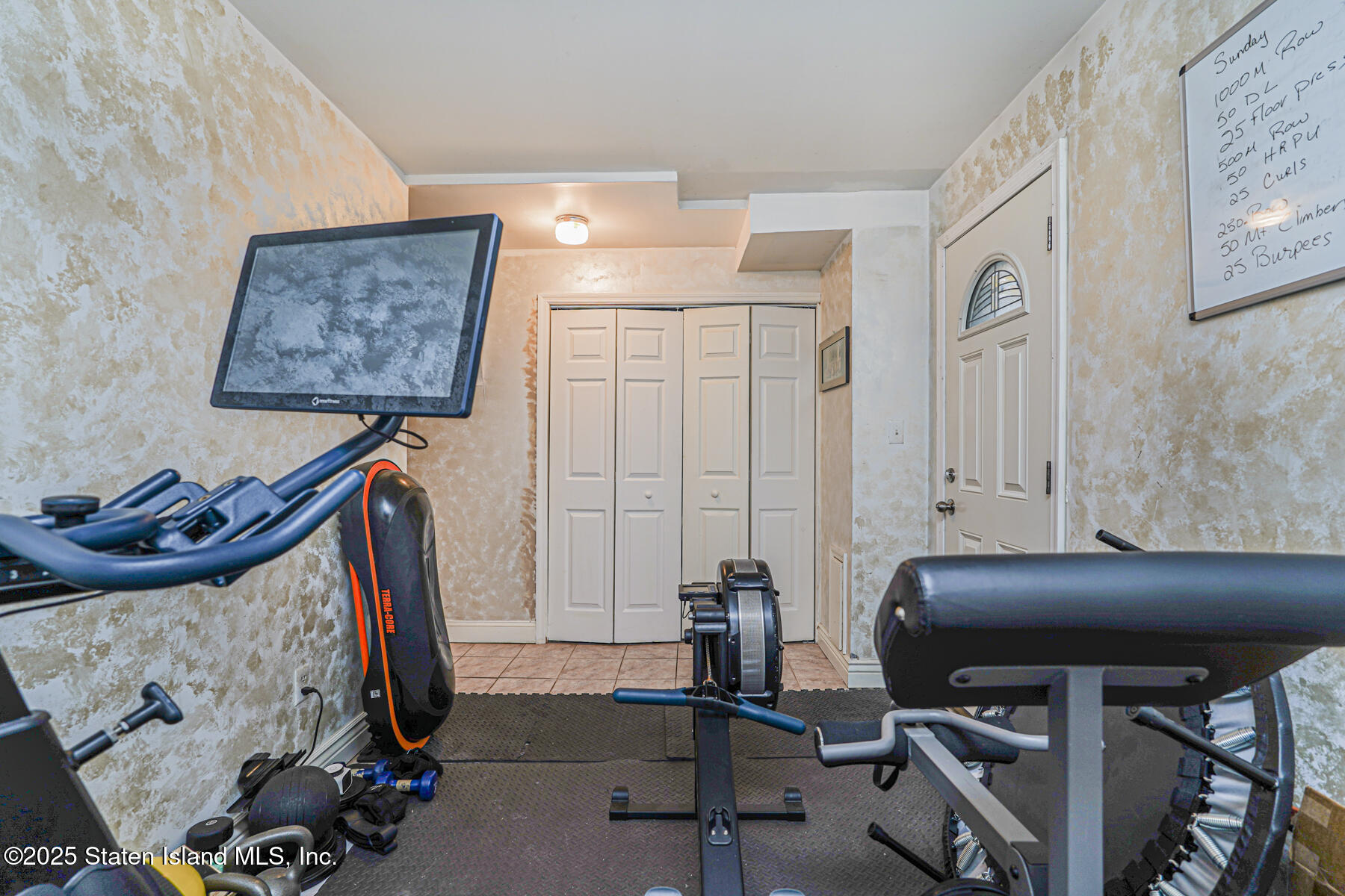 121 Clark Lane Staten Island, NY 10304 - Photo 16 of 18 a view of a room with gym equipment