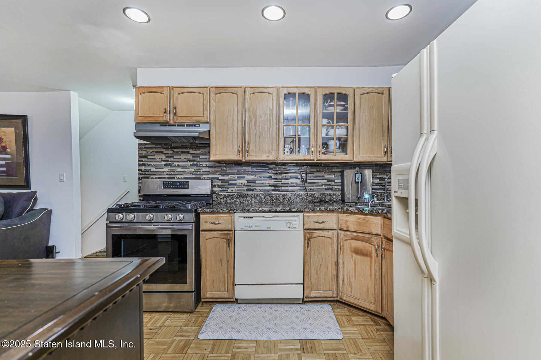 121 Clark Lane Staten Island, NY 10304 - Photo 4 of 18 a kitchen with stainless steel appliances granite countertop a stove a sink and a granite counter tops