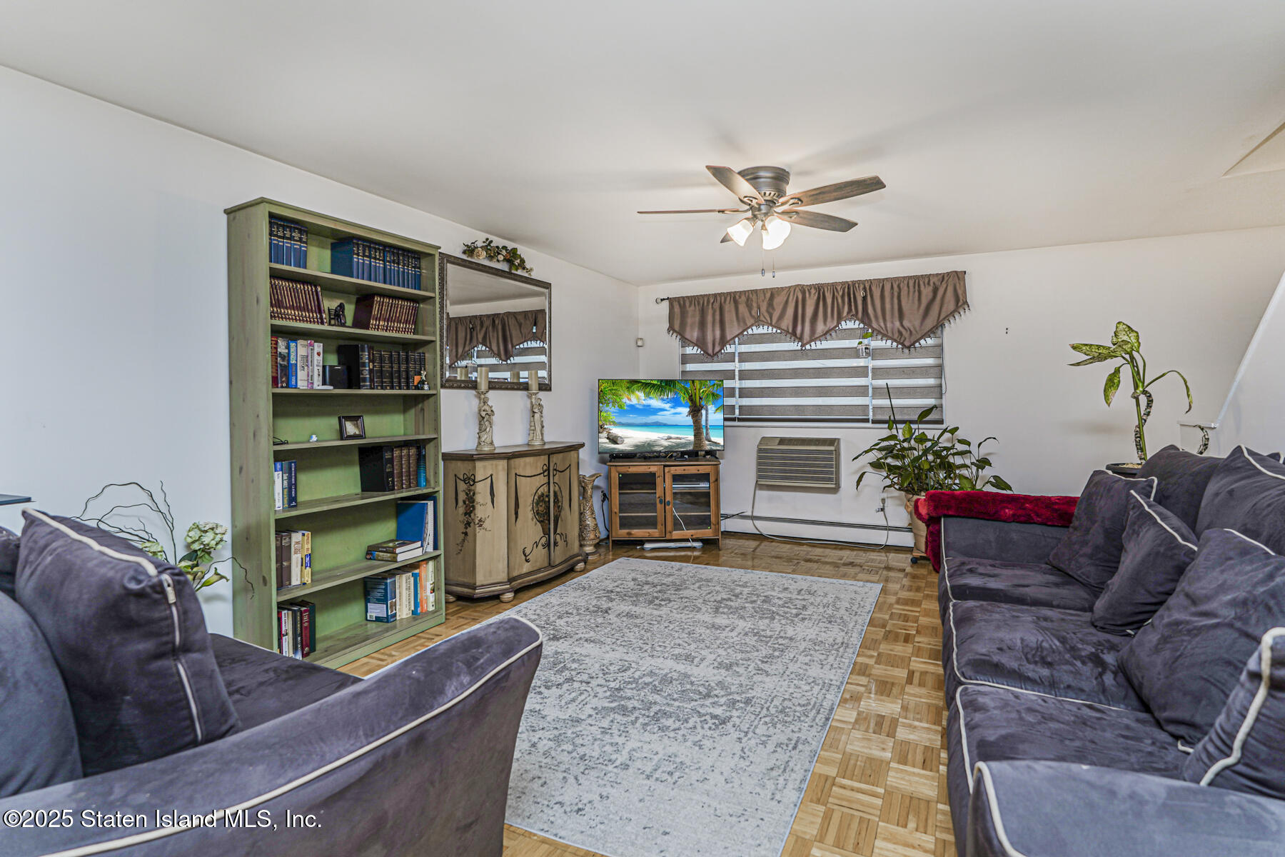 121 Clark Lane Staten Island, NY 10304 - Photo 6 of 18 a living room with furniture and a fireplace