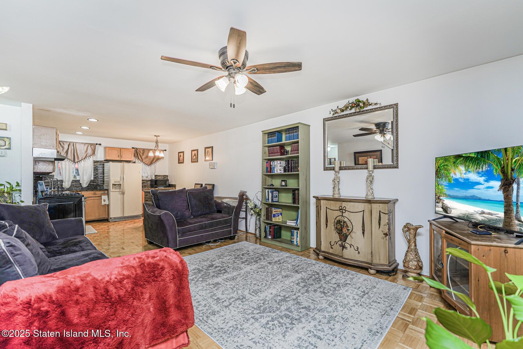 121 Clark Lane Staten Island, NY 10304 - Photo 7 of 18 a living room with furniture and a flat screen tv