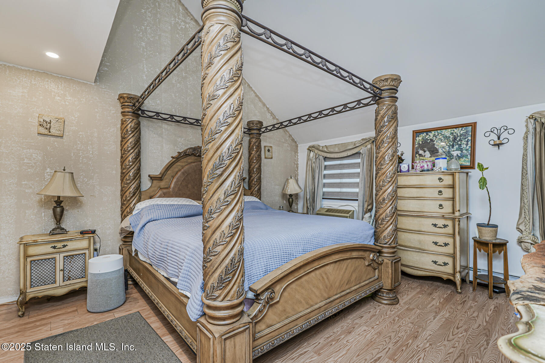 121 Clark Lane Staten Island, NY 10304 - Photo 9 of 18 a bedroom with a bed and a cabinet