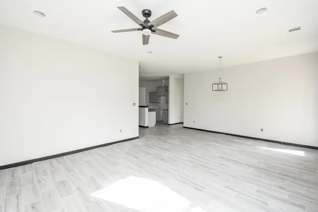 a view of a big room with carpet