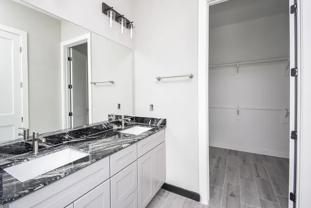 a bathroom with a sink and a mirror