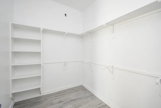 a view of an empty walk in closet
