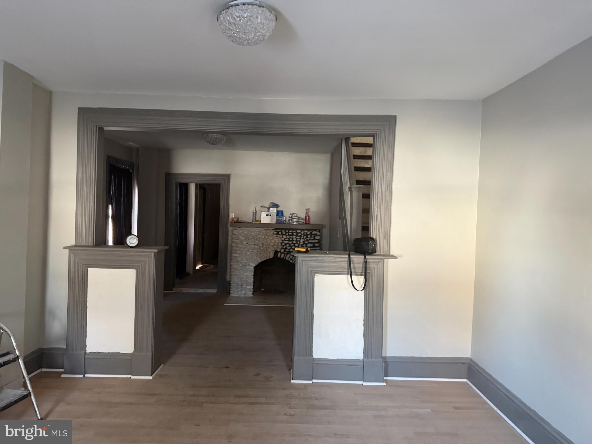 1410 Pennington Road Trenton, NJ 08618 - Photo 14 of 15 a view of a hallway with wooden floor and a living room
