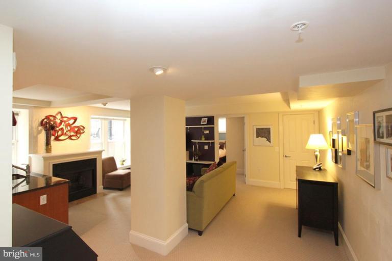 1750 16th Street Northwest, Unit 4 Washington, DC 20009 - Photo 14 of 20 a view of living room with furniture and flat screen tv