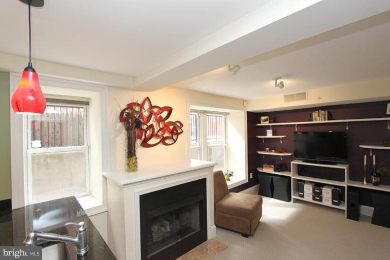 1750 16th Street Northwest, Unit 4 Washington, DC 20009 - Photo 16 of 20 a view of a livingroom with furniture and staircase