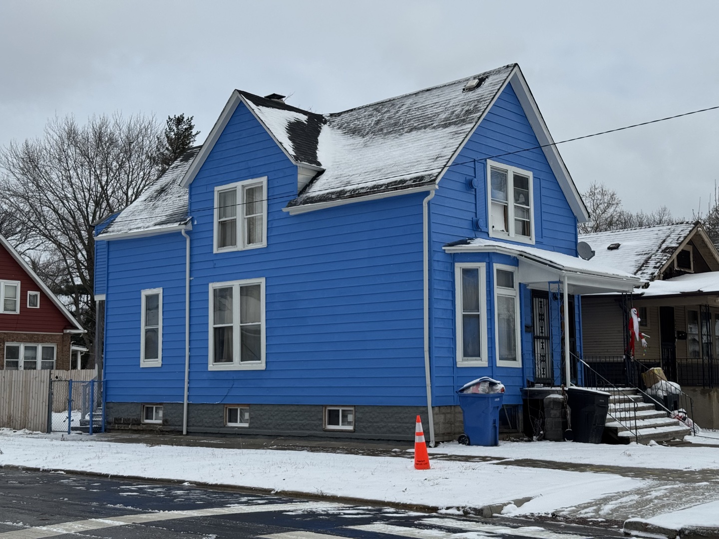 324 West 114th Street Chicago, IL 60628 - Photo 2 of 2 a front view of a house with a garden