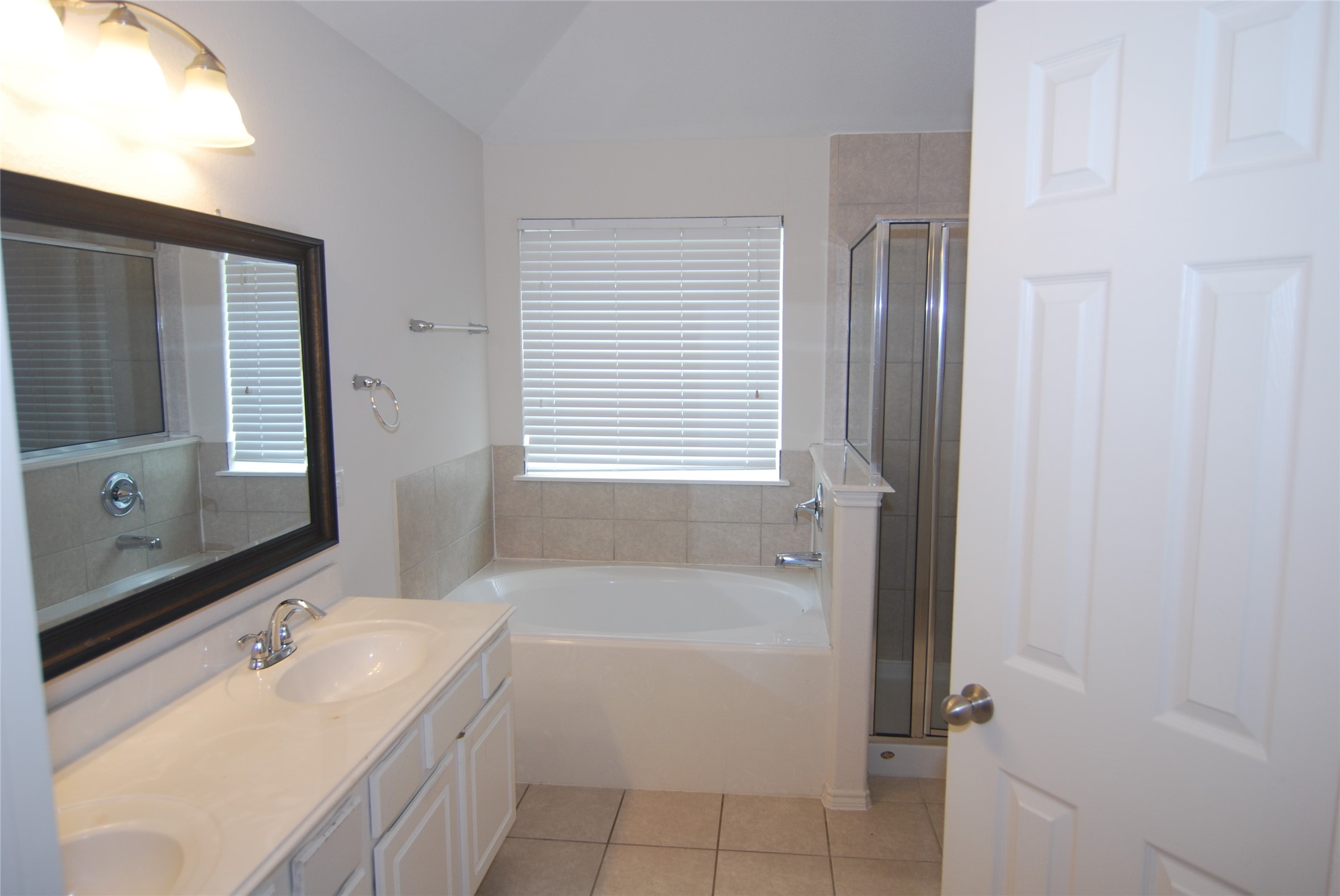 2834 Lockeridge Pines Drive Spring, TX 77386 - Photo 12 of 20 Primary bath with double sinks, soaking tub, separate shower, and private commode.