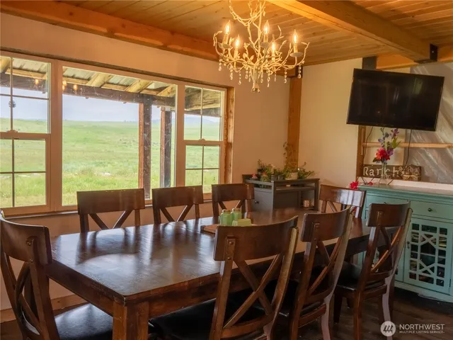 a view of a dining room with furniture window and outside view