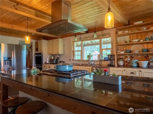 a kitchen with lots of counter top space and dining table