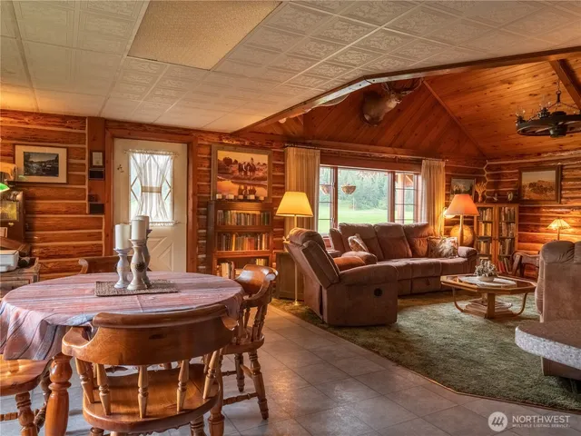 a living room with a couch and a dining table