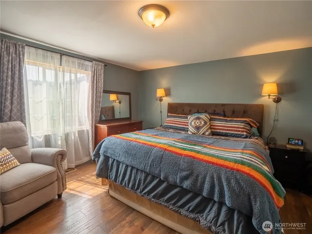 a bedroom with a bed and window